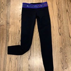 Barely worn Ivivva black leggings with purple band